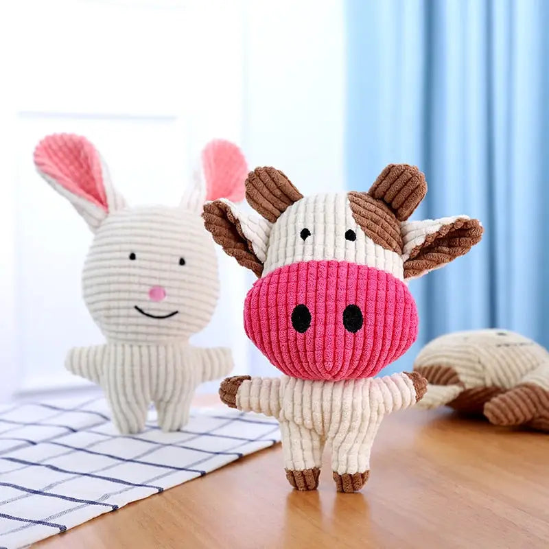Vache en peluche sur une table en bois de Fun Donkey Toy with Squeaker forme dâne jouet
