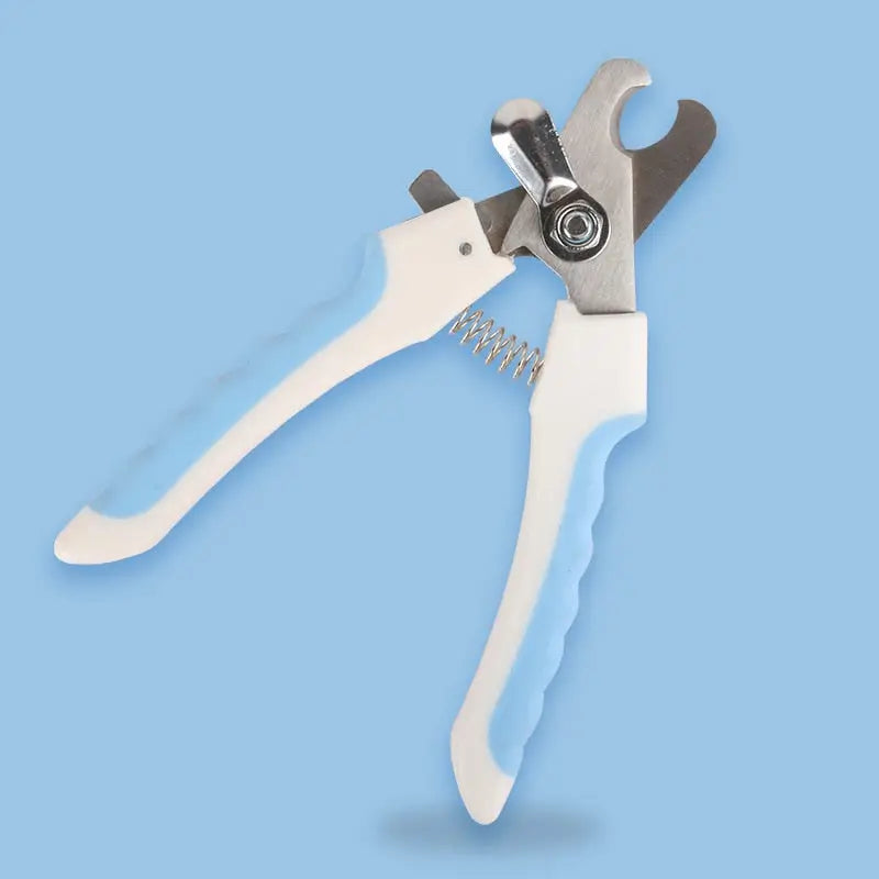 Essential Pet Tool - White Pliers for Precise Cutting | Outil Essentiel Coupe | Blue Background